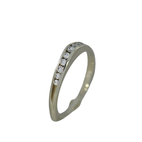 Gold ring with small diamonds on a gray background