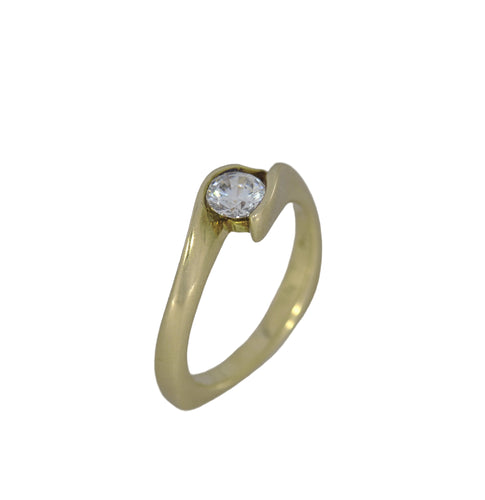 Gold ring with a diamond on a white background