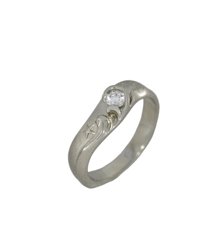 Silver ring with a diamond on a white background