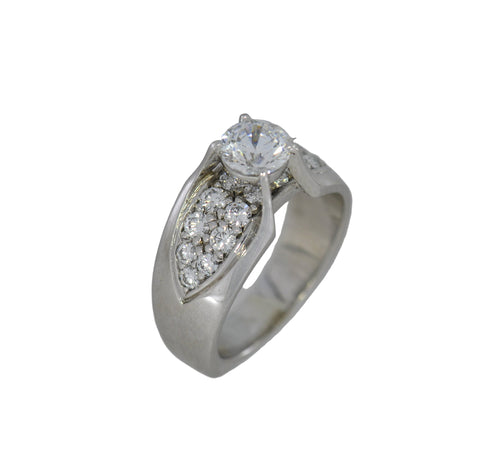 Silver ring with a diamond on a white background