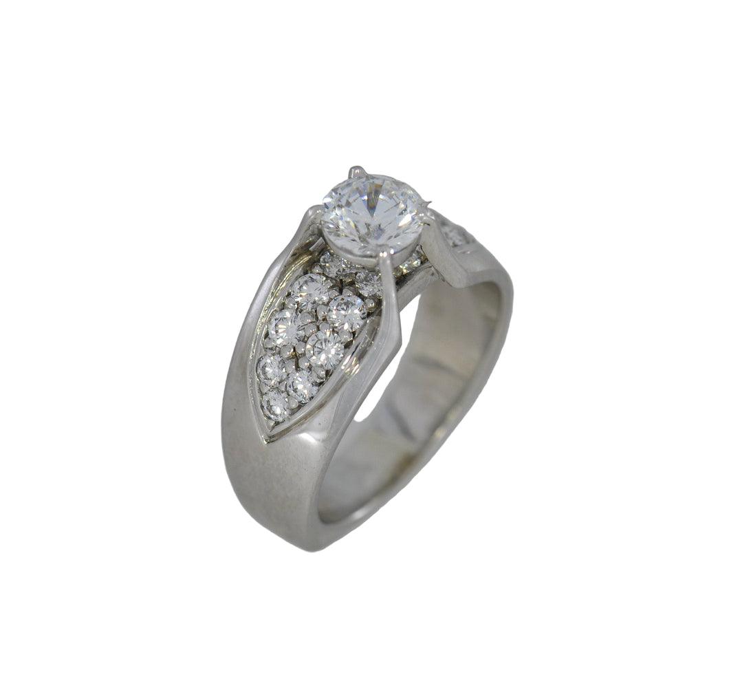 Silver ring with a diamond on a white background