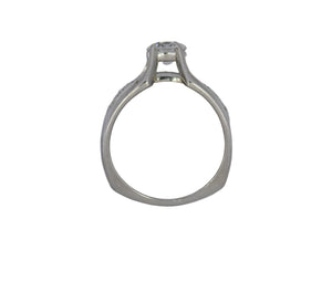 Silver ring with a diamond on a white background