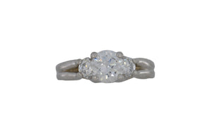 Diamond ring on a reflective white surface