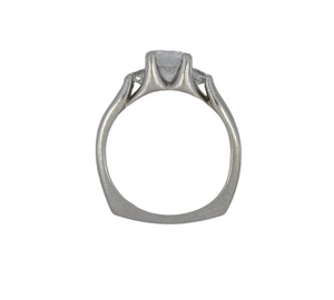 Silver ring with a diamond on a white background