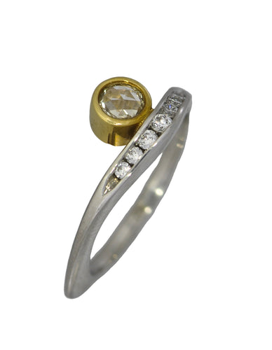 Diamond ring, in gold and white, on a white background