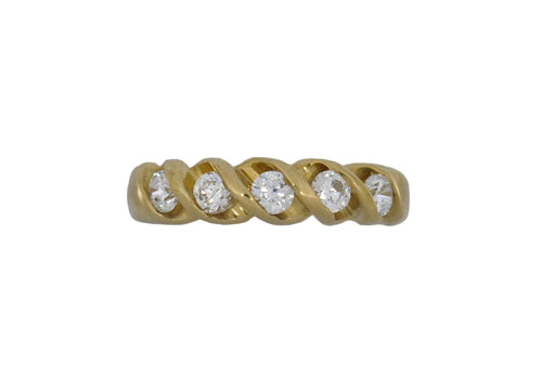 Gold ring with diamonds on a white background