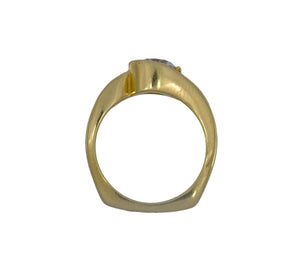 Gold ring with a diamond on a white background