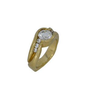 Gold ring with a diamond on a white background