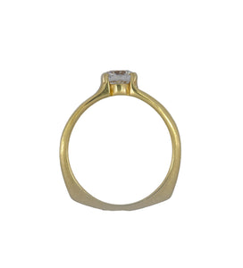 Gold ring with a diamond on a white background