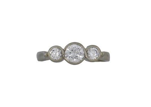 White gold  ring with three diamonds on a white background