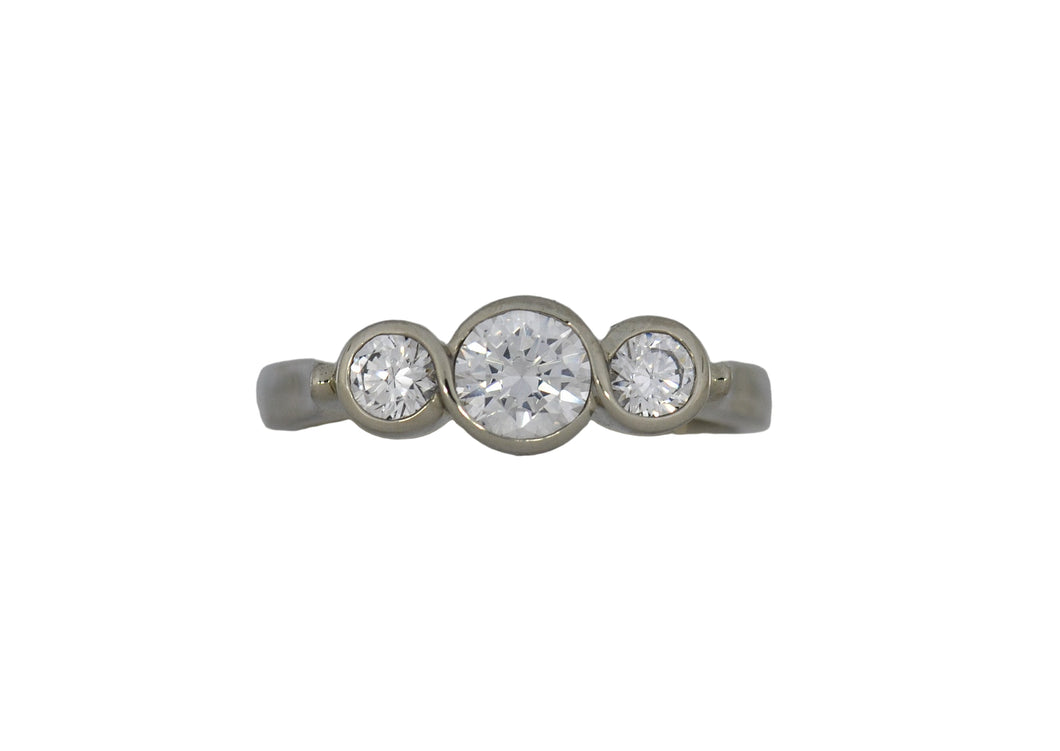 White gold  ring with three diamonds on a white background