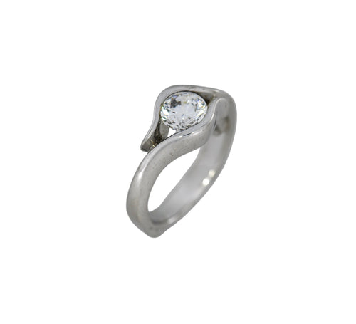 white gold ring with a diamond on a white background