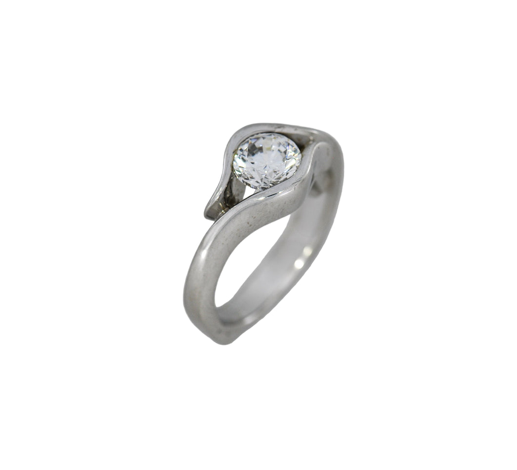 white gold ring with a diamond on a white background