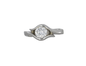 white gold ring with a diamond on a white background