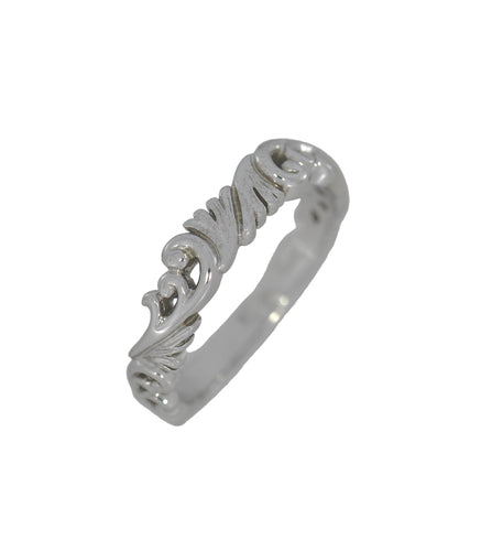 White gold ring with intricate design on a white background