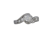 Load image into Gallery viewer, White gold ring with a central diamond and smaller diamonds on a white background
