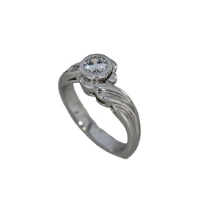 white gold ring with a diamond on a white background