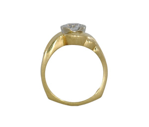 Gold ring with a diamond on a white background