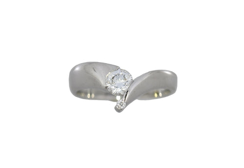 White gold ring with a diamond on a white background