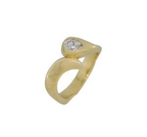 Gold ring with a diamond on a white background