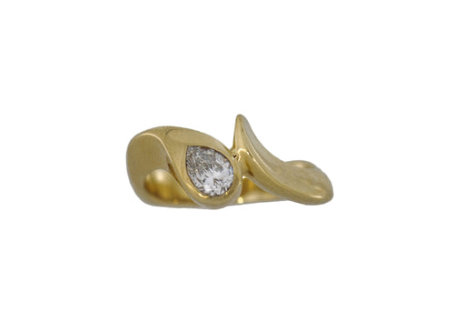 Gold ring with a diamond on a white background