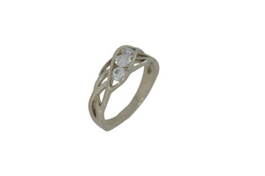 white gold ring with three round diamonds on a white background
