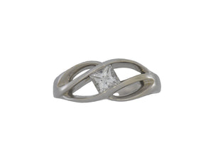 White gold ring with a diamond on a white background