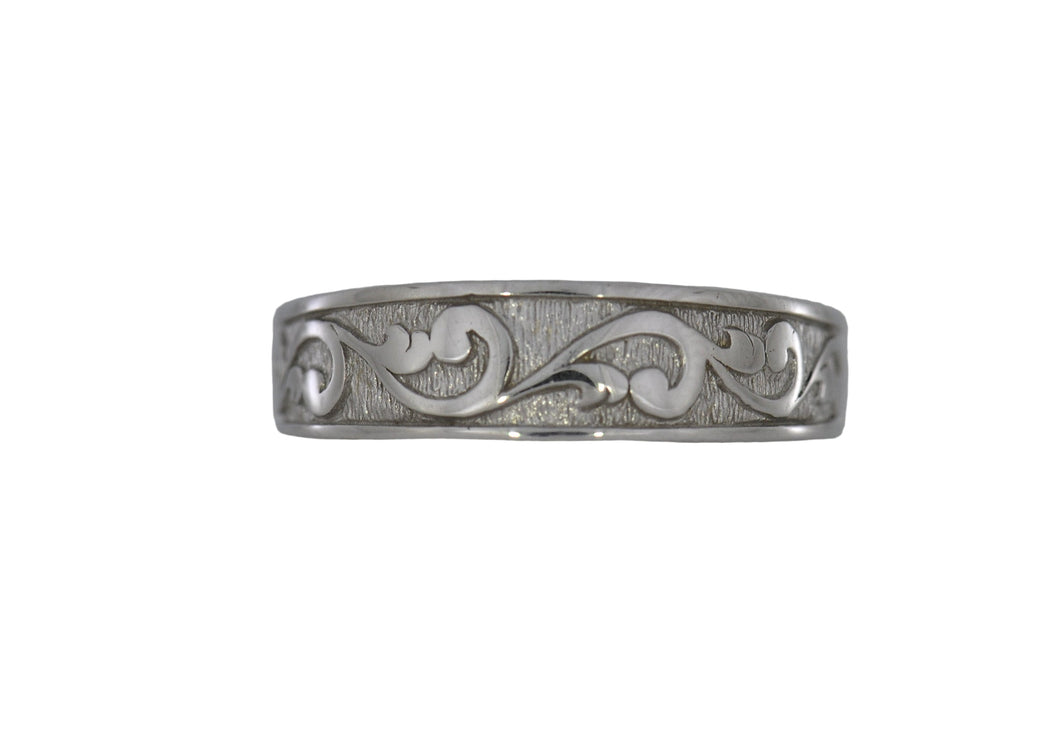 White Gold ring with intricate designs on a white background