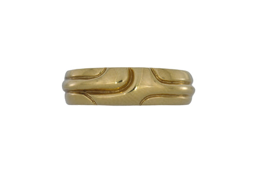 Gold ring with a unique design on a white background