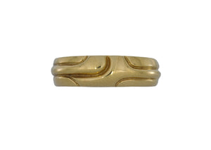 Gold ring with a unique design on a white background