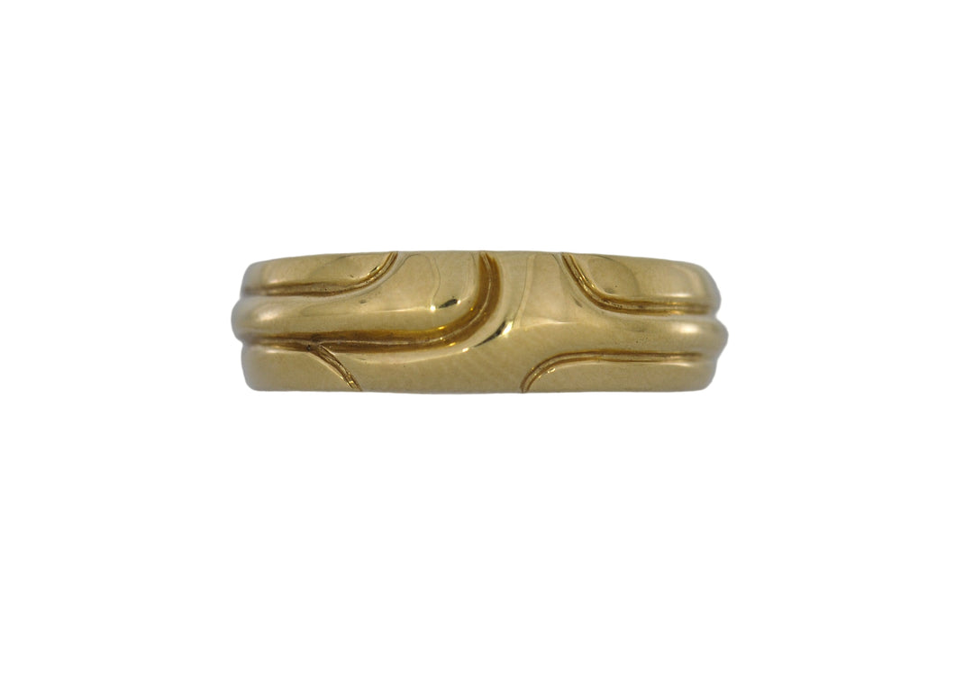 Gold ring with a unique design on a white background