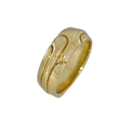 Gold ring with a wavy design on a white background