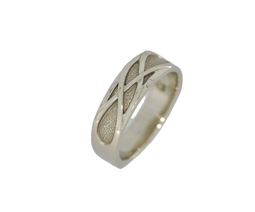 Silver ring with a textured design on a white background