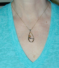 Load image into Gallery viewer, moderately sized pendant on thin neck
