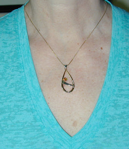 moderately sized pendant on thin neck