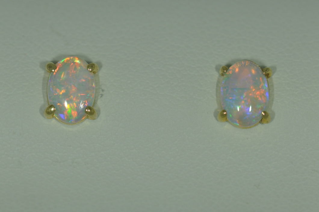 7 x 5 mm Oval Opal Studs in Yellow Gold